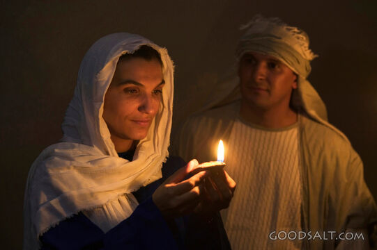 Isrealite Woman Hold Lit Oil Lamp in the Dark As Man Looks O