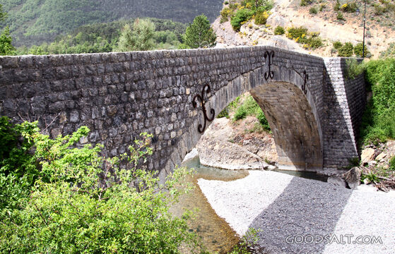Stone Arch Bridge Over Mountain Stream