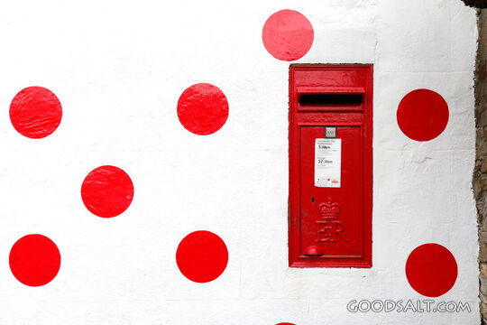 Red Post Box in White Wall