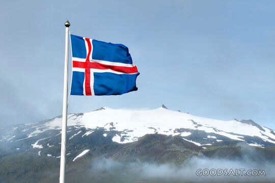 Icelandic Cross Flag Over Mountain Peaks