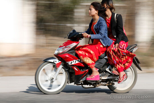 Two Women Riding a Motorbike