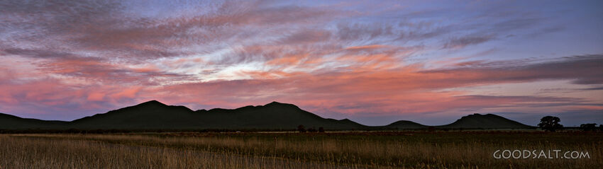 Landscape With Mountains and Pink Coulds