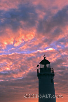 Lighthouse at Sunset With Pink Clouds