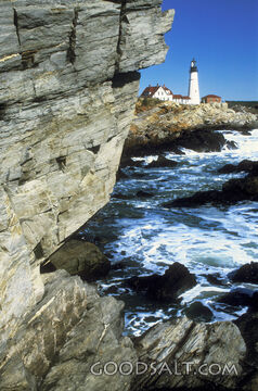 Lighthouse at the Ocean With Huge Rocks