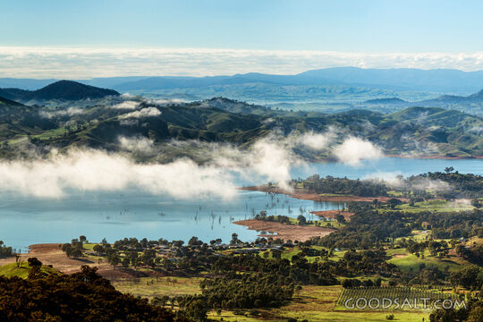 Mountainous foggy country from heights above.