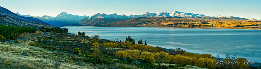 Mountains behind lake waters.