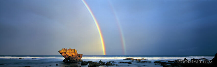 Oceanscape With Large Rock and Two Rainbows