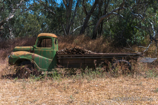 Old Austin tray truck at historic farm.