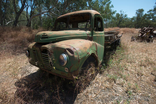 Old Austin tray truck at historic farm.