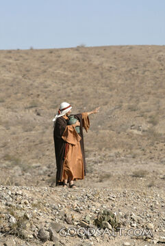 Woman Pointing in the Judean Wilderness