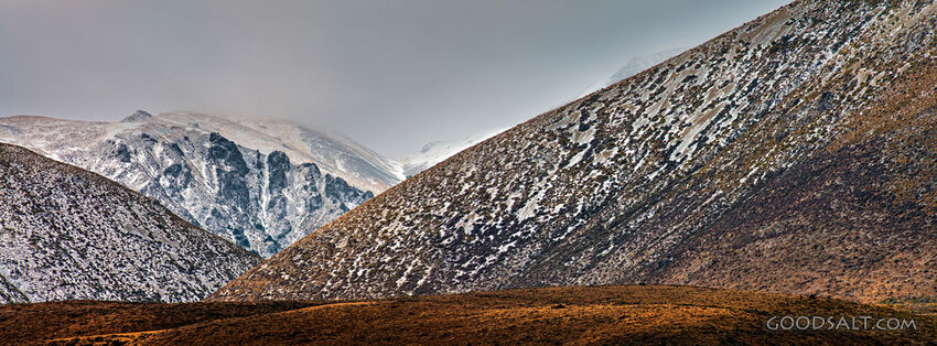 river valley running through snowy terrain