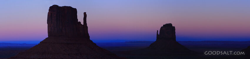 ARIZONA. Monument Valley. Panorama of The Mittens silhoutted