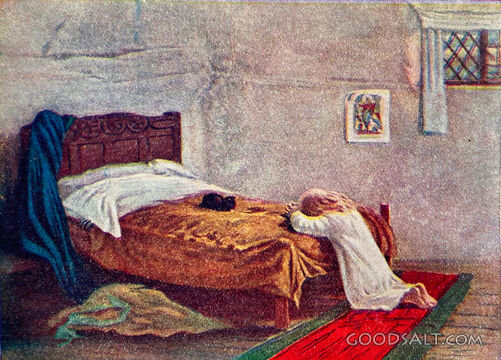 poor child little girl kneeling next to bed praying