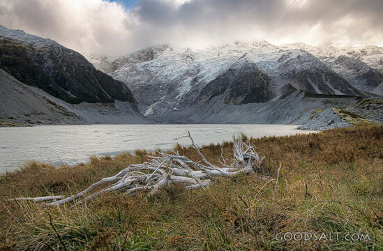 Spectacular alpine scenery of rocks, boulders, snow and water.