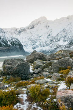 Spectacular alpine scenery of rocks, boulders, snow and water.