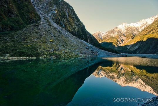 Spectacular landscape of an icy flood hole beside glacial river.