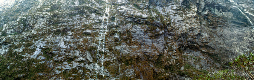 Stunning scenery which contains a waterfall in alpine remote landscape.