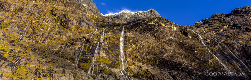 Stunning scenery which contains a waterfall in alpine remote landscape.