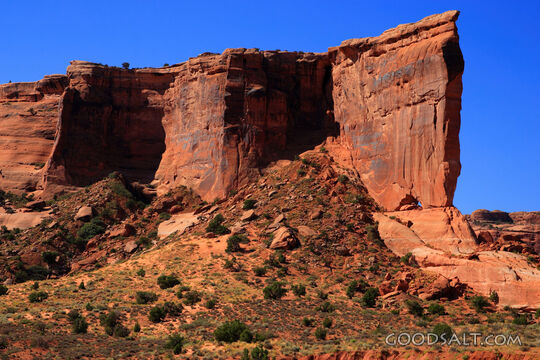 UTAH. Arches National Park. Baby Arch and cliff wall in mid 