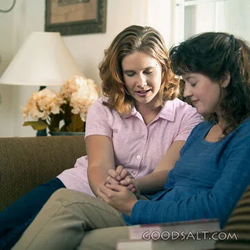 Friends Praying Together at Home