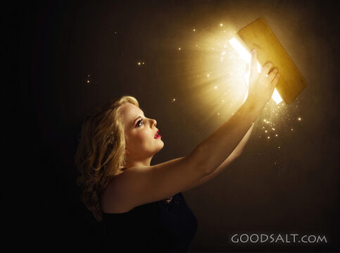 Woman Holding a Glowing Bible