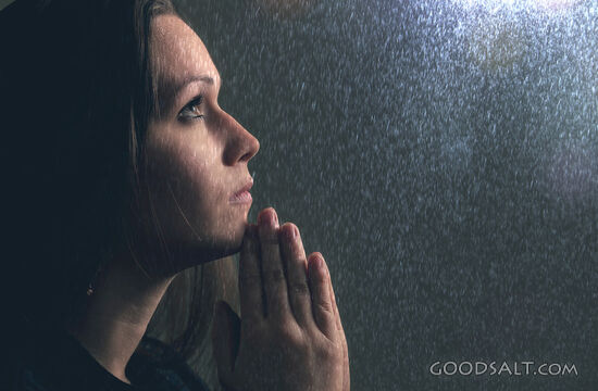 Woman Prays in Rain