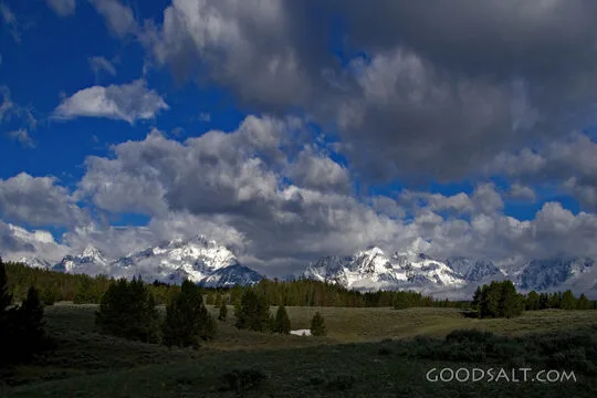 WYOMING. Teton National Park. Clouds over Tetons and prarie.