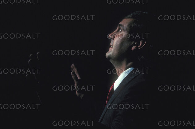 Man Lifting His Hands in Prayer