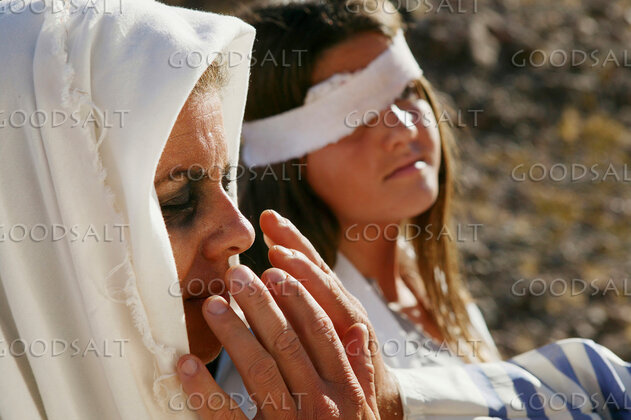 Mother Praying Over Her Wounded Daughter