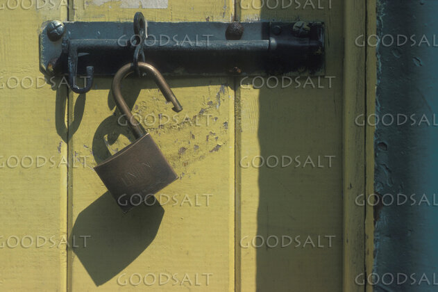 Unlocked Door and Weathered Bolt