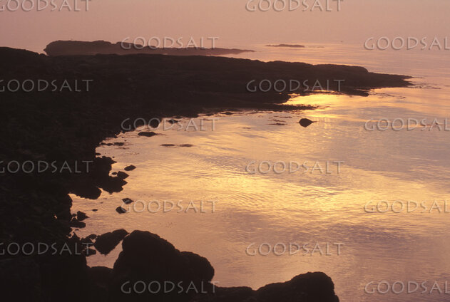 Sunset Over the Rocky Shore