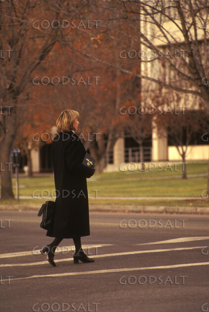 Woman Crossing the City Street