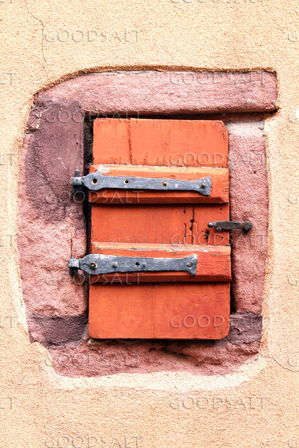 Rustic Shutter in Stone Wall