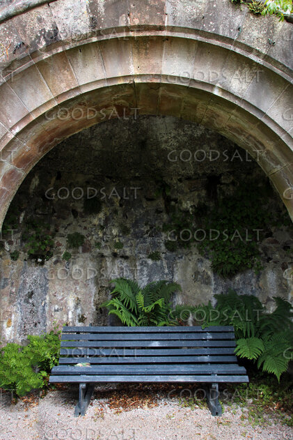 Quiet Prayer Bench Beneath the Stone Arch