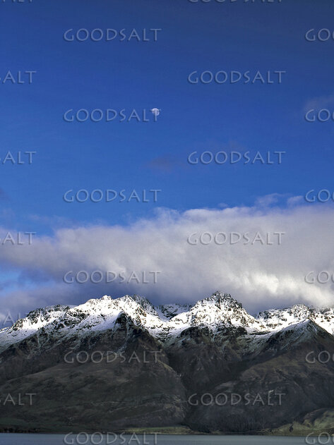 Moon Above Snow-Crowned Mountains