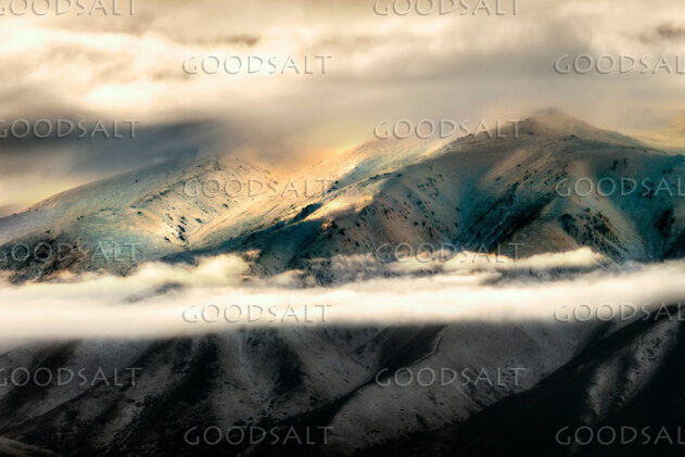 Light Breaking Over the Mountain Peaks