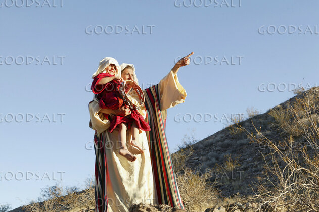 Father Teaching His Child on the Hillside