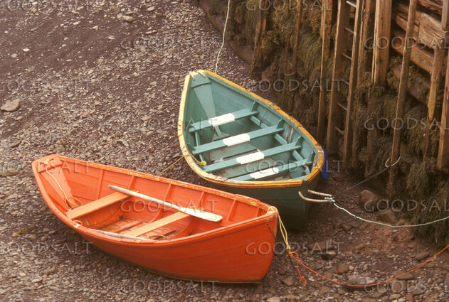Rowboats Fastened on a Rocky Shore