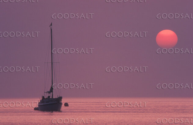 Sailboat at Sunset on Still Waters