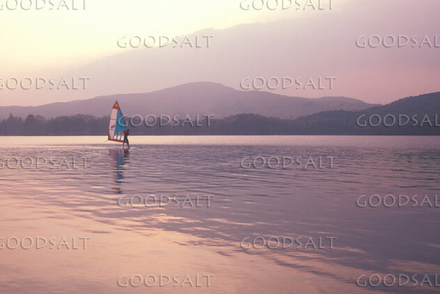 Windsurfer on Still Mountain Waters