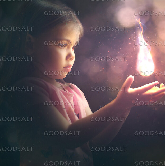 Little Girl Holding a Light