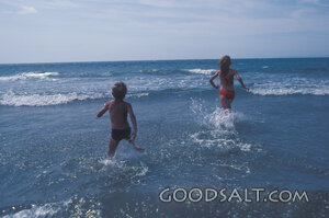 Children Running Into the Surf
