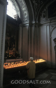 Prayer Among Votive Candles