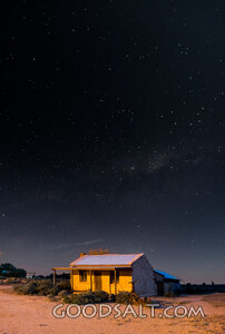 historic miner's house under stars