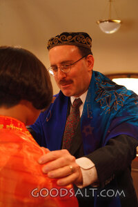 IDAHO. Boise. Rabbi blessing Asian Jewish girl on the bimah 