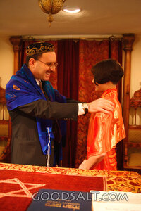 IDAHO. Boise. Rabbi blessing Asian Jewish girl on the bimah