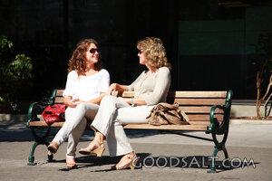 IDAHO. Boise. Two women seated on bench, talking. MR