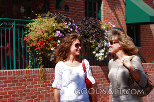 IDAHO. Boise. Two women walking on sidewalk, smiling. MR