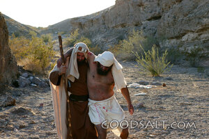 The Good Samaritan Lifts the Wounded Man