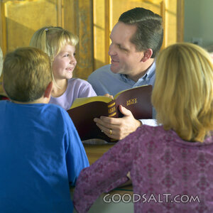 Father Teaching Children from the Holy Bible